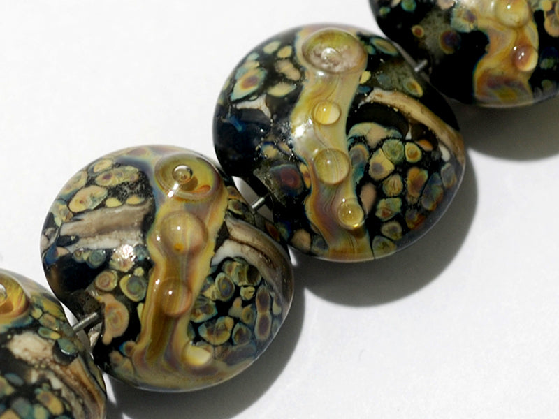 10902302 - Seven Cheyenne Rock Lentil Beads
