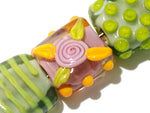 11001704 - Seven Pink/Orange/Green Tile Beads