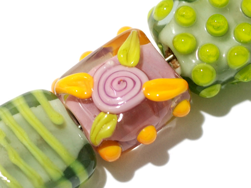 11001704 - Seven Pink/Orange/Green Tile Beads