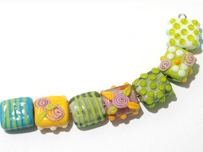 11001704 - Seven Pink/Orange/Green Tile Beads