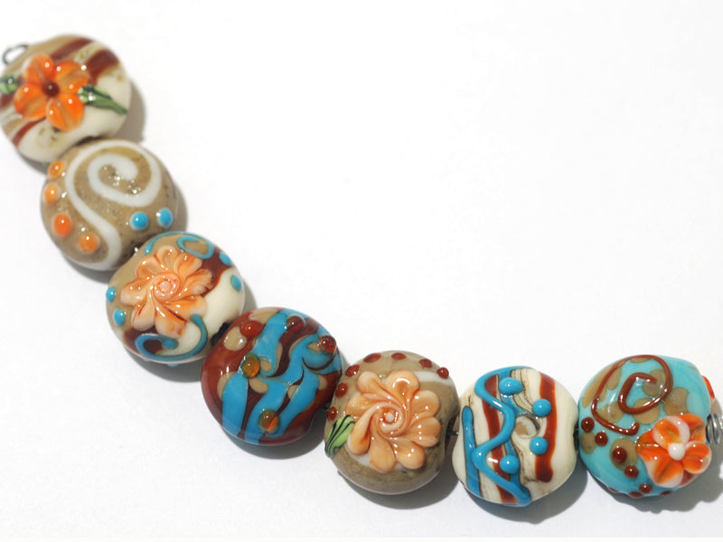 11002202 - Seven Turquoise w/Brown Lentil Beads