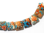 11002204 - Seven Turquoise w/Brown Pillow Beads