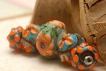 11002211 - Five Graduated Turquoise w/Brown Rondelle Beads