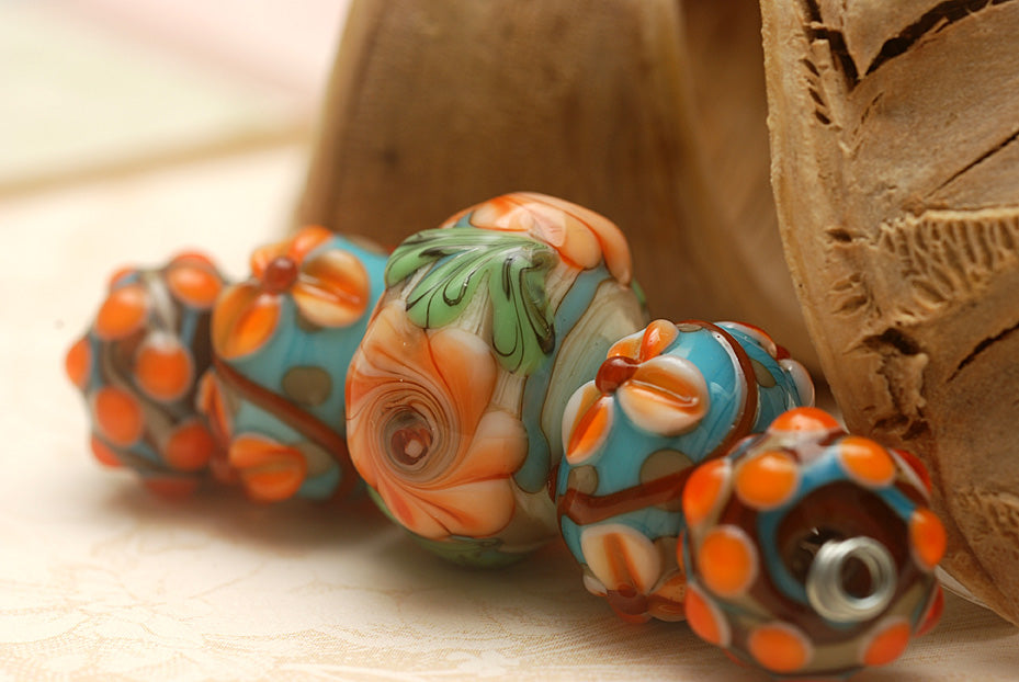 11002211 - Five Graduated Turquoise w/Brown Rondelle Beads