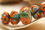 11002211 - Five Graduated Turquoise w/Brown Rondelle Beads