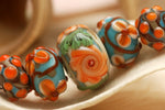 11002211 - Five Graduated Turquoise w/Brown Rondelle Beads