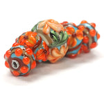 11002211 - Five Graduated Turquoise w/Brown Rondelle Beads