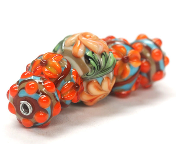 11002211 - Five Graduated Turquoise w/Brown Rondelle Beads