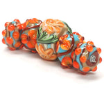 11002211 - Five Graduated Turquoise w/Brown Rondelle Beads