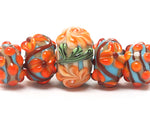 11002211 - Five Graduated Turquoise w/Brown Rondelle Beads