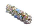 11005401 - Seven Light Pink w/Blue Floral Rondelle Beads
