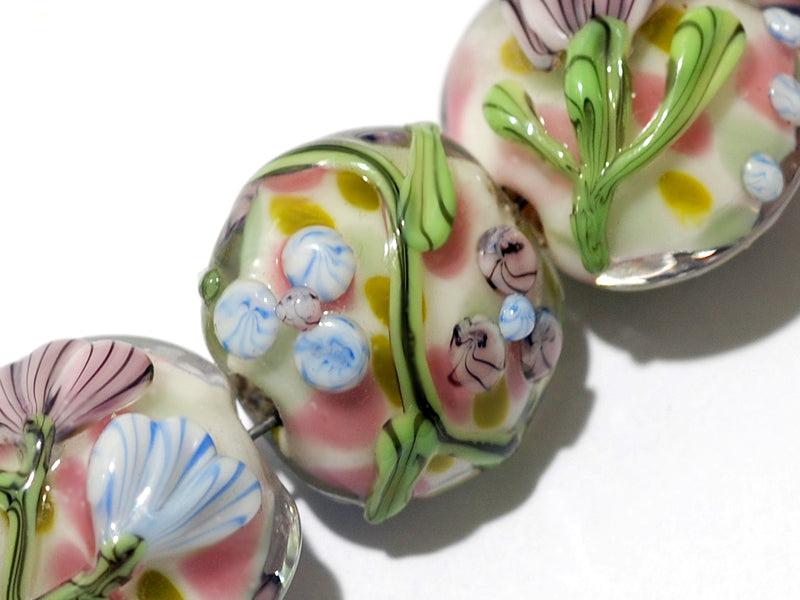 11005402 - Seven Light Pink w/Blue Floral Lentil Beads