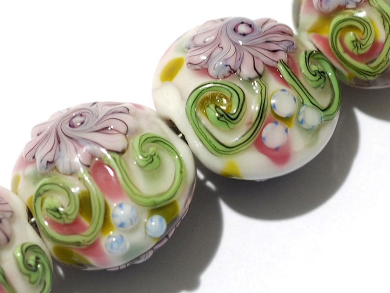 11005412 - Four Light Pink w/Blue Floral Lentil Beads