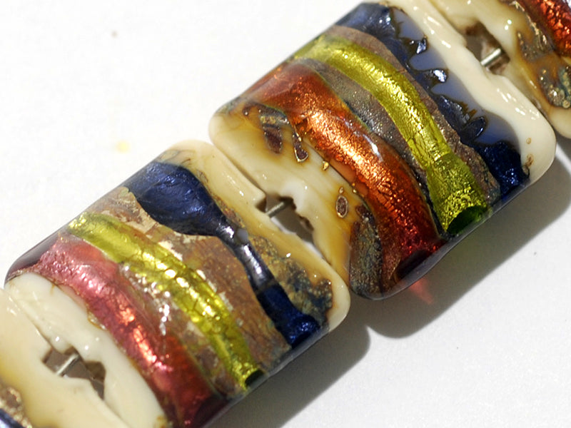 11005604 - Seven Multi-colored & Ivory Pillow Beads