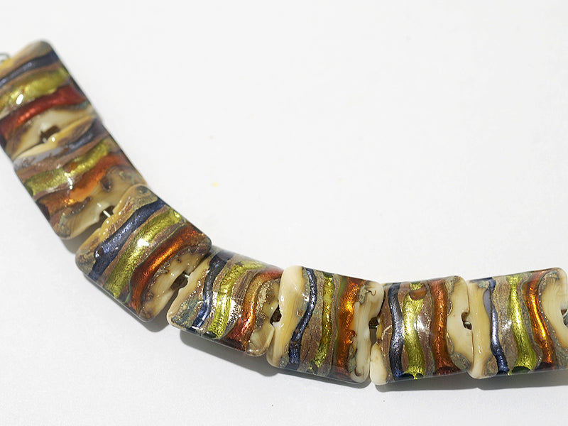 11005604 - Seven Multi-colored & Ivory Pillow Beads