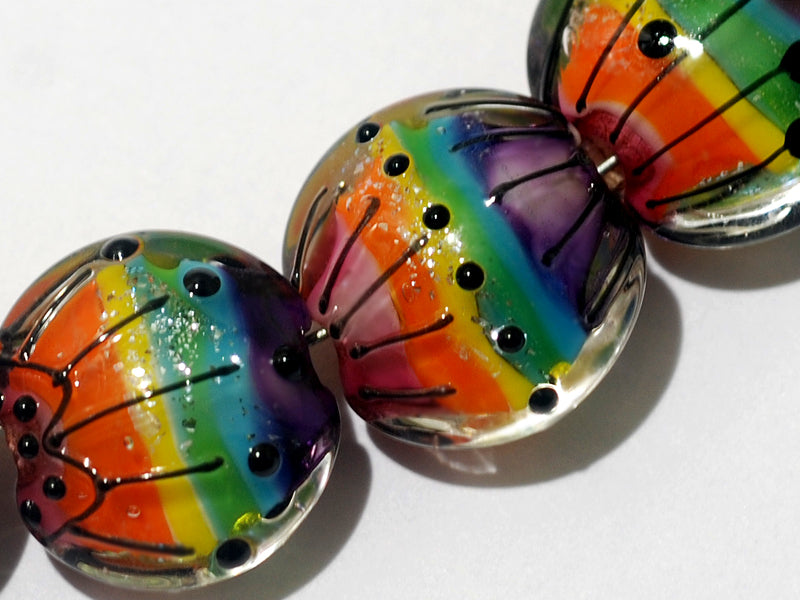 11008202 - Seven Rainbow Balloons Lentil Beads