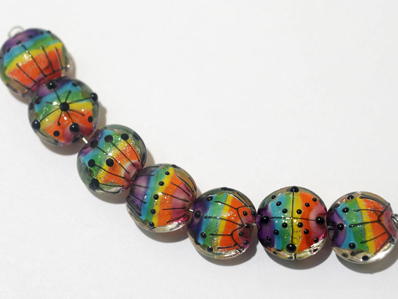 11008202 - Seven Rainbow Balloons Lentil Beads