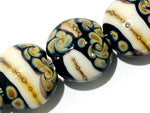 11105002 - Seven Black/Ivory & Beige Lentil Beads