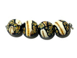11105012 - Four Black/Ivory & Beige Lentil Beads