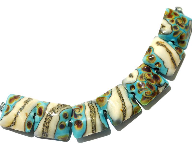 11105104 - Seven Turquoise/Ivory & Beige Pillow Beads
