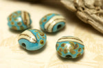 11105112 - Four Turquoise/Ivory & Beige Lentil Beads