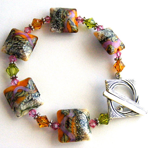 11105804 Bracelet using Coral w/Ivory Free Style Pillow Beads