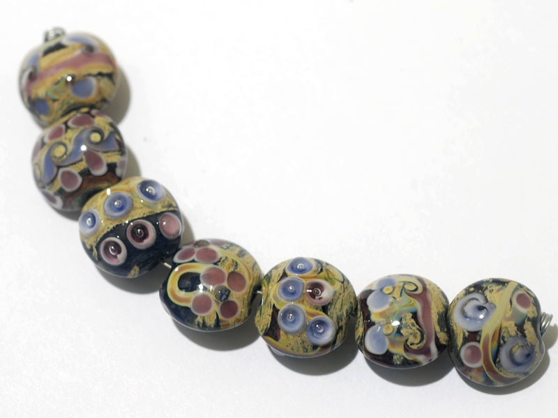 11106002 - Seven Purple w/Beige Lentil Beads