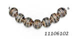 11106102 - Seven Transparent Brown w/Beige Strips Lentil Beads