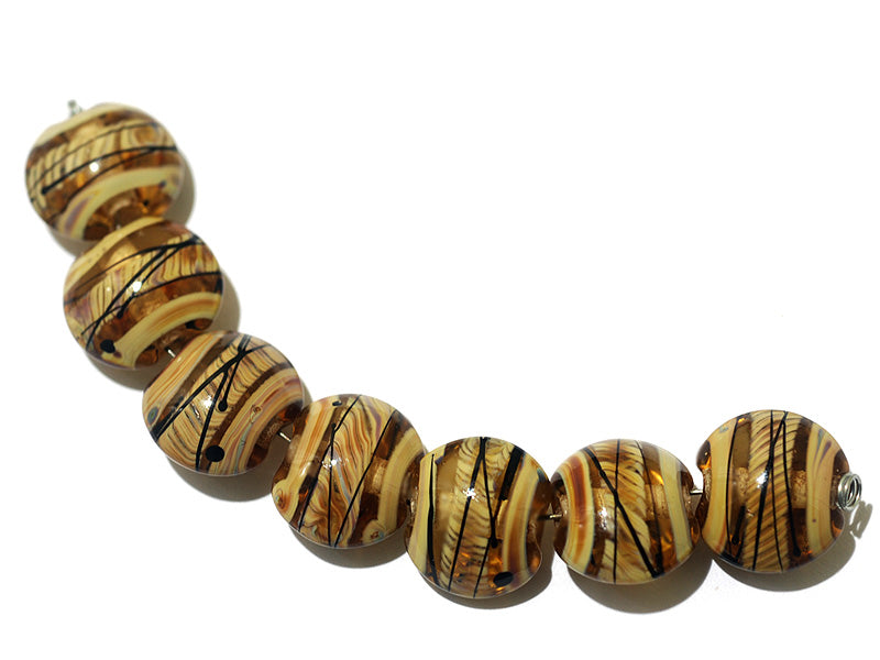 11106102 - Seven Transparent Brown w/Beige Strips Lentil Beads