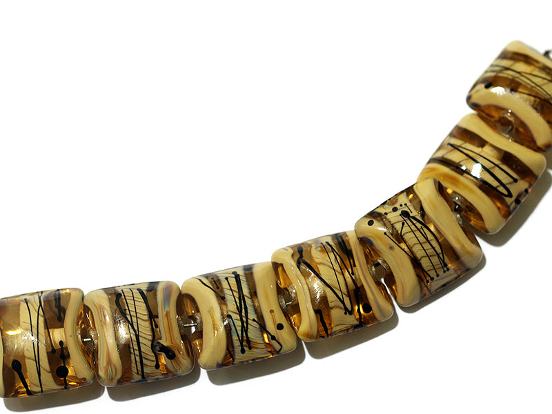 11106104 - Seven Transparent Brown w/Beige Strips Pillow Beads