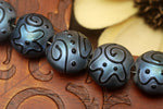 11204302 - Seven Blue Pearl Surface w/Black String Lentil Beads