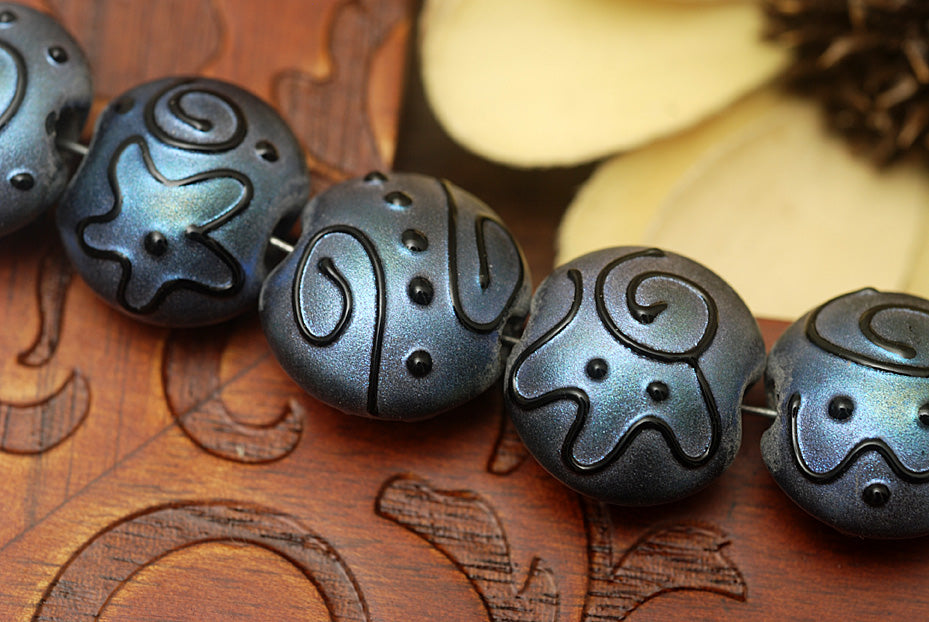 11204302 - Seven Blue Pearl Surface w/Black String Lentil Beads
