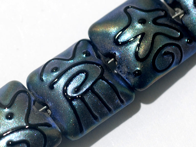 11204304 - Seven Blue Pearl Surface w/Black String Pillow Beads