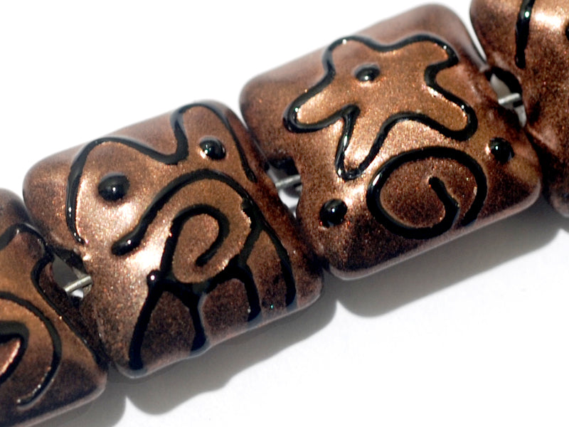 11204404 - Seven Copper Pearl Surface w/Black Swirl Pillow Beads
