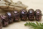 11204501 - Seven Light Purple Pearl Surface Rondelle Beads