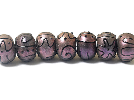 11204501 - Seven Light Purple Pearl Surface Rondelle Beads
