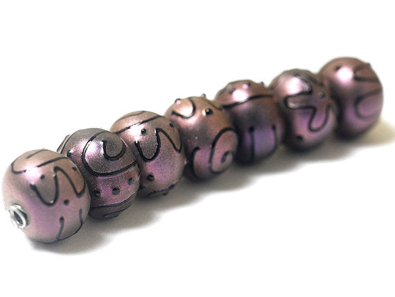 11204501 - Seven Light Purple Pearl Surface Rondelle Beads