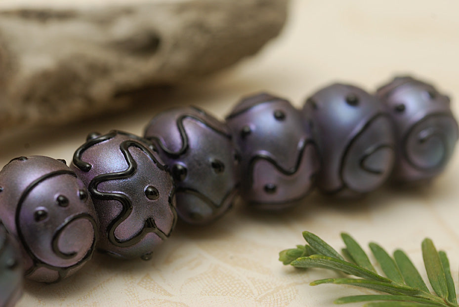 11204701 - Seven Purple Pearl Surface Rondelle Beads