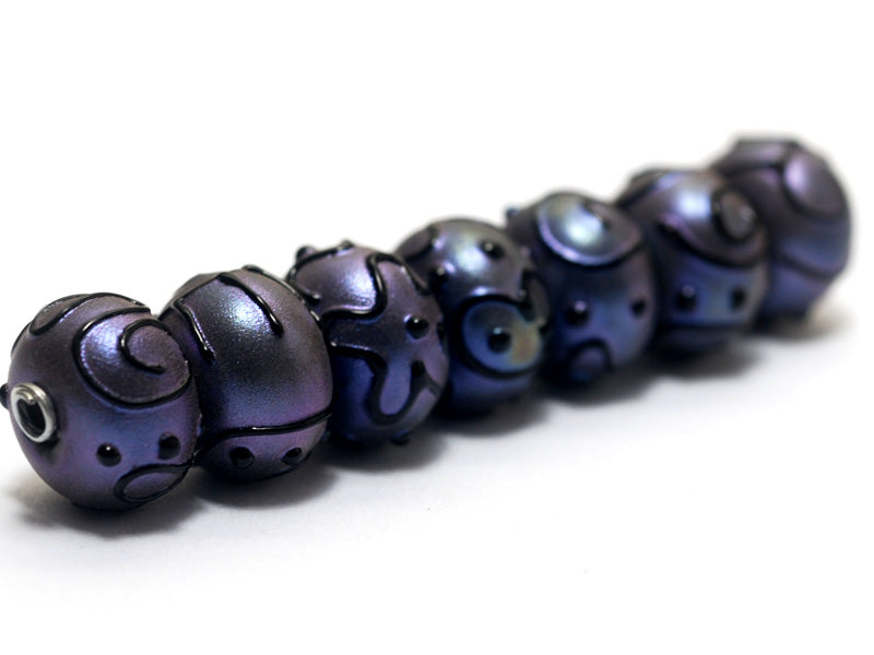 11204701 - Seven Purple Pearl Surface Rondelle Beads