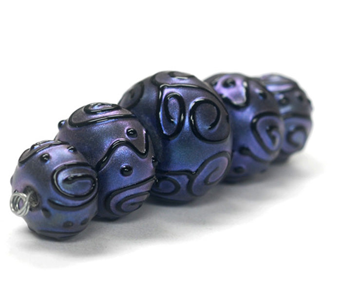 11204711 - Five Graduated Purple Pearl Surface Rondelle Beads