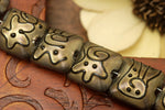 11204804 - Seven Golden Pearl Surface w/Black Pillow Beads