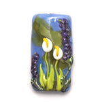 Decorative glass piece with flowers on a white background