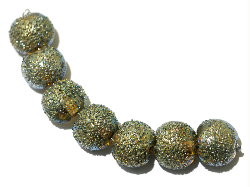 40101002 - Seven Golden Green Metallic Lentil Beads