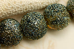 40101002 - Seven Golden Green Metallic Lentil Beads