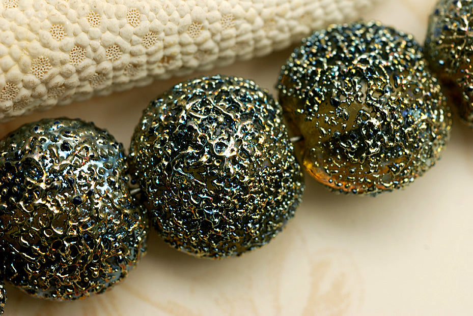 40101002 - Seven Golden Green Metallic Lentil Beads