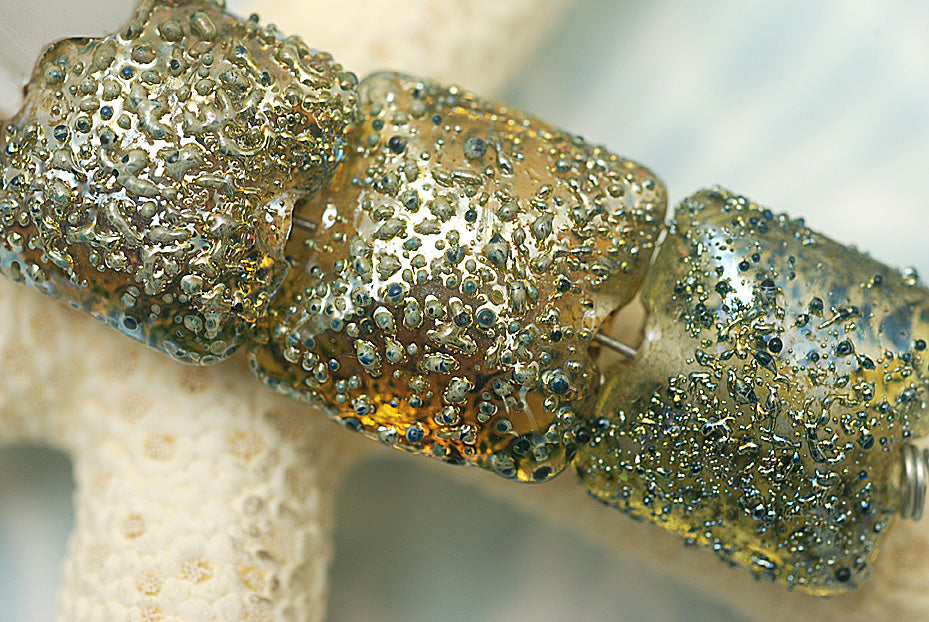 40101014 - Four Golden Green Metallic Pillow Beads