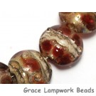 10703802 - Seven Transparent Red w/Silver Foil Lentil Beads