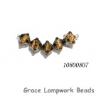10800807 - Five Black w/Yellow Silver Foil Crystal Beads