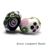 10107501 - Seven Black/White w/Flower & Leaf Rondelle Beads