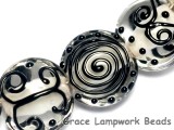 10202302 - Seven Black & White Lentil Beads